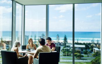 Students Charlotte Michau, Stefanie Strauss and Jackson North enjoying views from Gold Coast campus. Photo taken during filmshoot