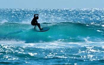 Surfers Paradise, Australia - November 14, 2014: Surfer surfing in Main beach. It's a very popular surfing beach in Surfers Paradise Gold Coast Queensland, Australia.