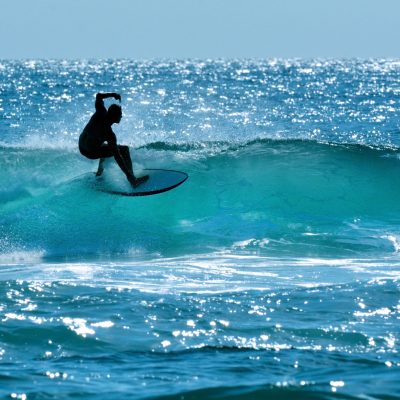 Surfers Paradise, Australia - November 14, 2014: Surfer surfing in Main beach. It's a very popular surfing beach in Surfers Paradise Gold Coast Queensland, Australia.