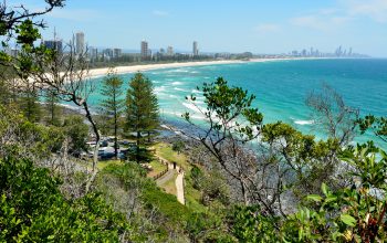 Burleigh Heads, Gold Coast, Queensland, Australia - January 13, 2018. View from Burleigh Heads National Park, toward Surfers Paradise, with buildings, cars, vegetation and people.